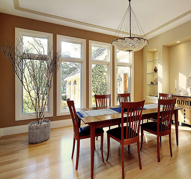 Four replacement casement windows in a dining room